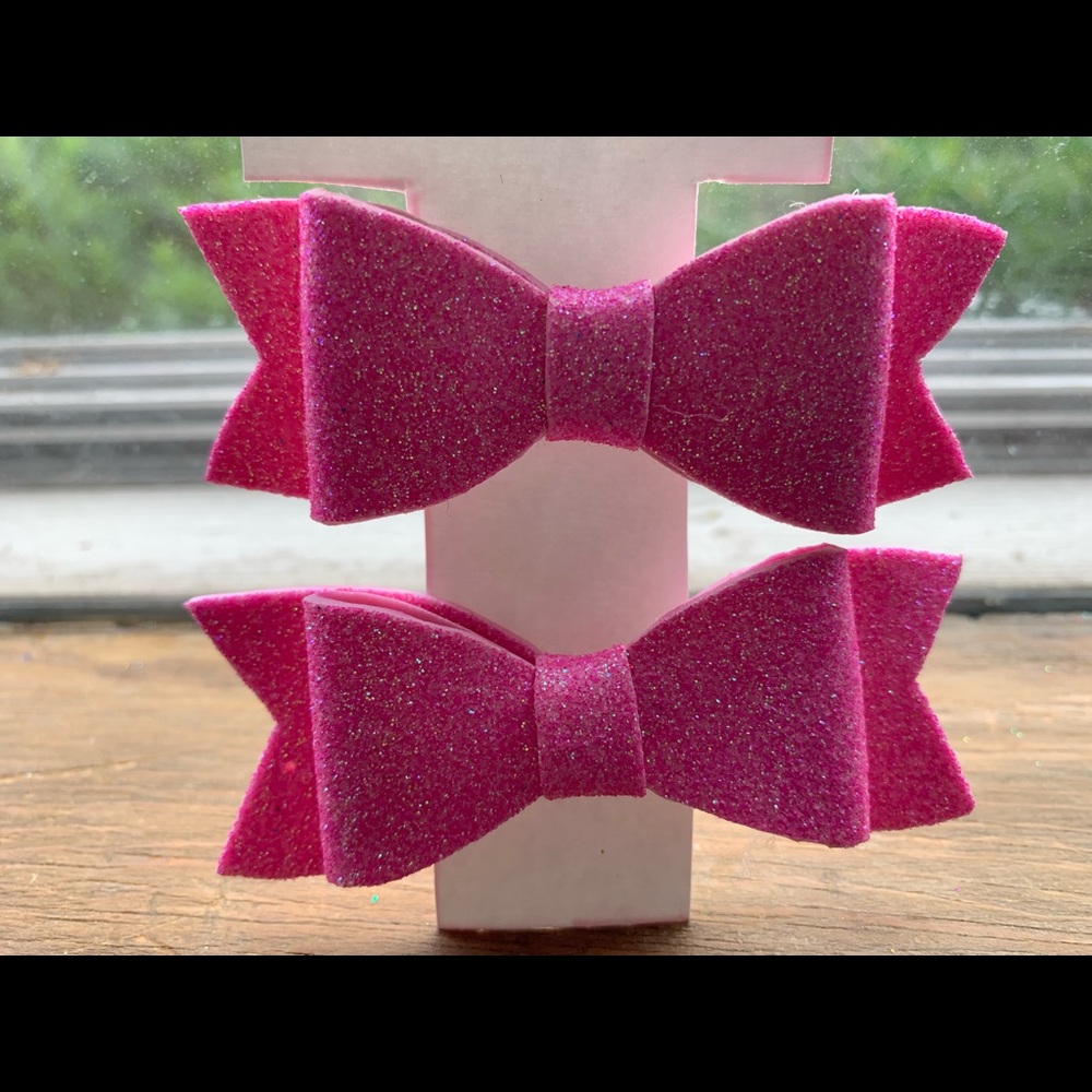 Pair of pastel pink hair bows